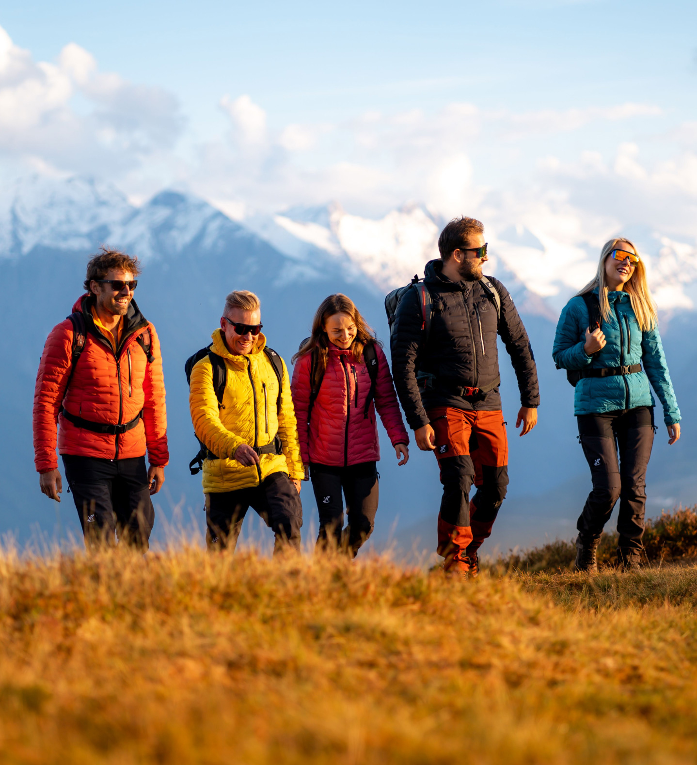 Colourful hikers in the alps with Flex Down Jacket