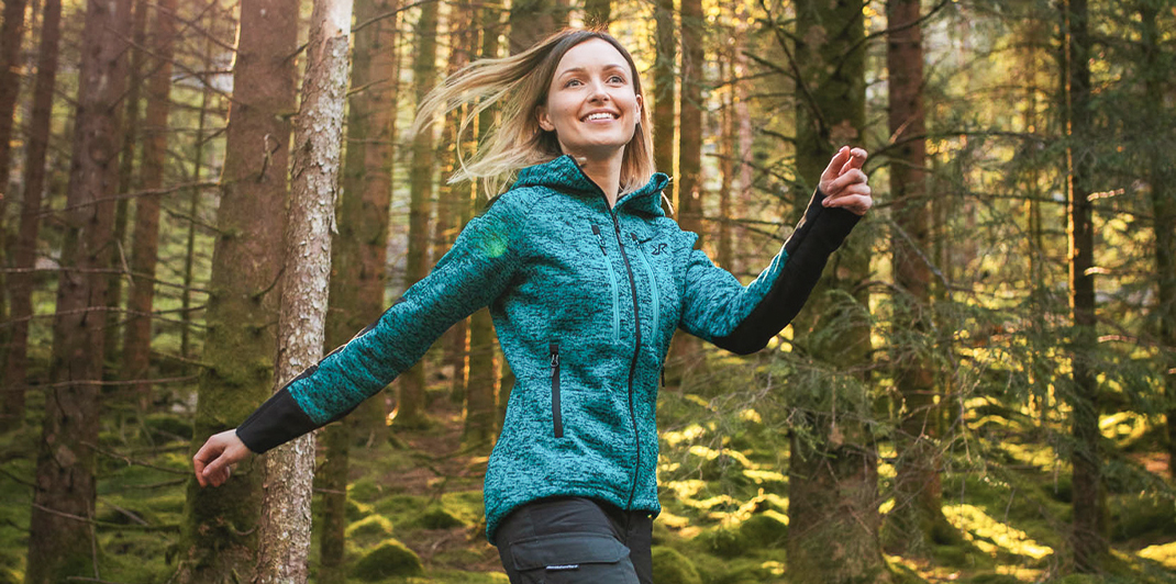 happy-woman-on-hike-wearing-tornado-hoodie-dark-turouise.jpg